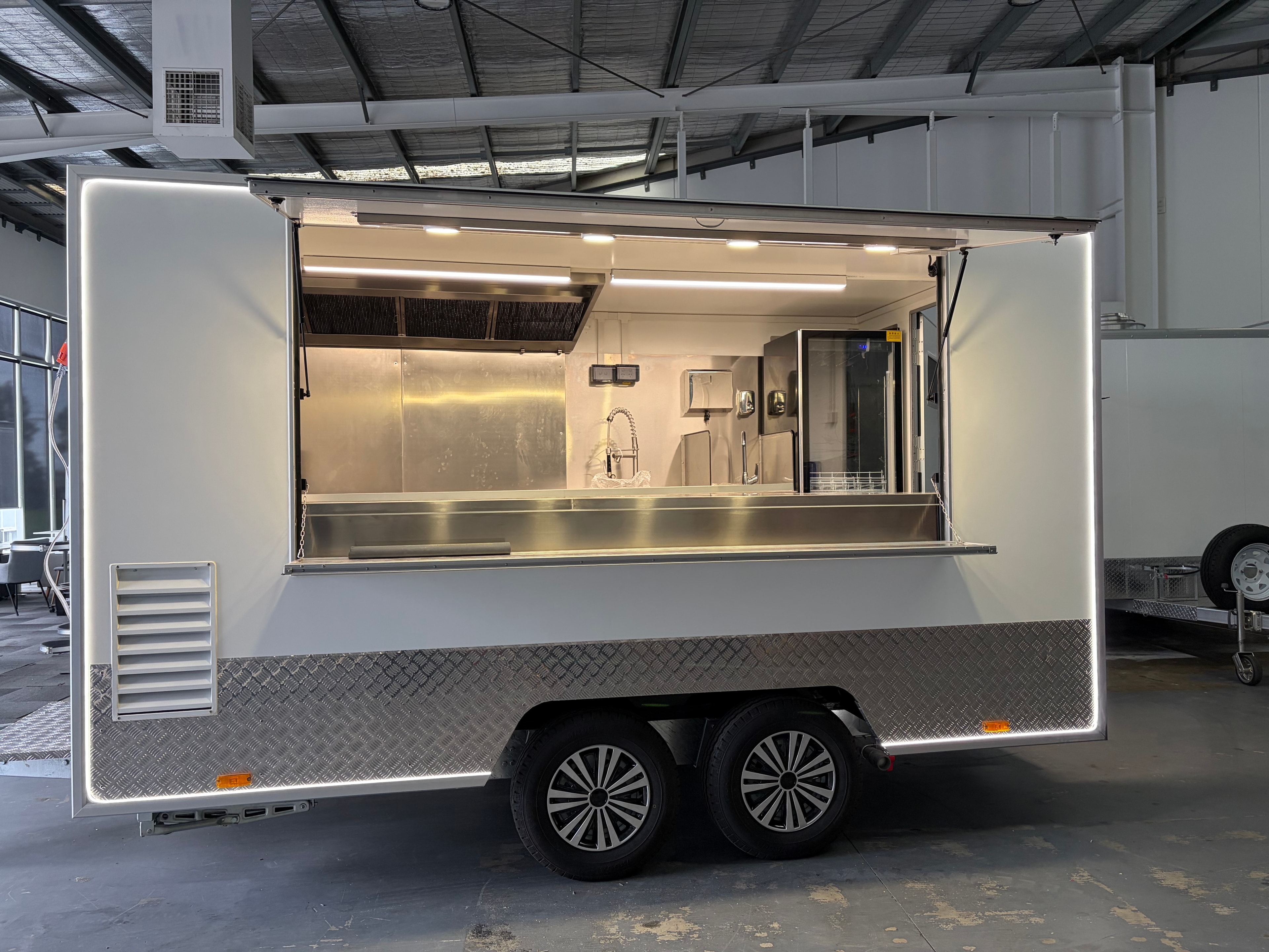 Food trailer exterior with LED halo lighting strip along the roofline